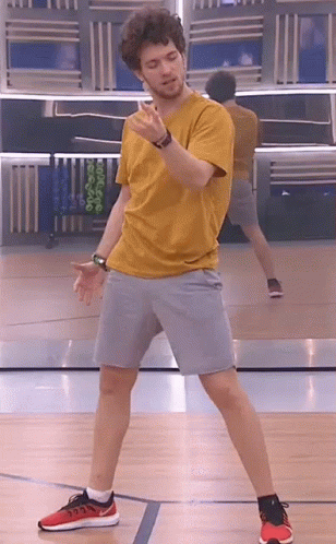 Man In Yellow T-Shirt Dancing On Basketball Court GIF
