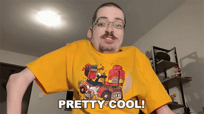 Man In Yellow T-Shirt Saying Pretty Cool GIF