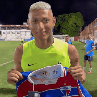 Man In Yellow Tank Top Holding Fortaleza Jersey GIF