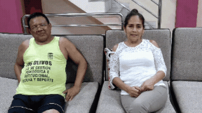 Man In Yellow Tank Top Los Olivos Sits Next To Woman In White Top GIF