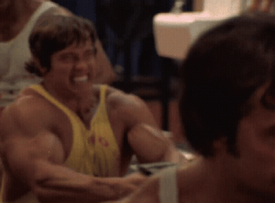 Man In Yellow Tank Top With Letter G Smiling GIF