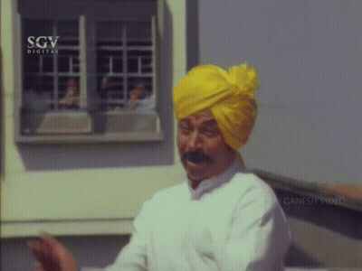 Man In Yellow Turban And White Shirt GIF