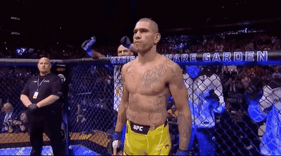 Man In Yellow UFC Shorts In Boxing Cage GIF