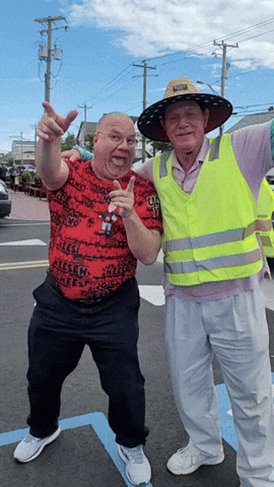 Man In Yellow Vest Saying Safety Next To Another Man GIF