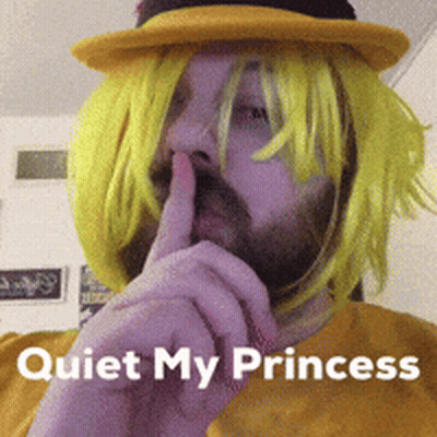 Man In Yellow Wig And Hat Shushing Quiet My Princess GIF