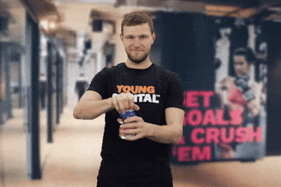 Man In Young Vital Shirt Opening Soda Can GIF
