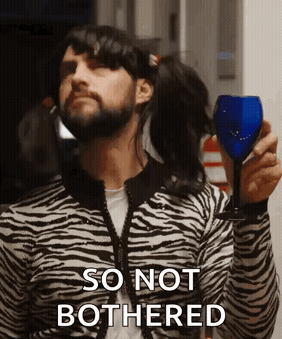 Man In Zebra Print Sweater Holding Wine Saying So Not Bothered GIF