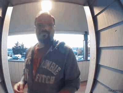 Man In Zombie Fitch Hoodie At Doorway GIF