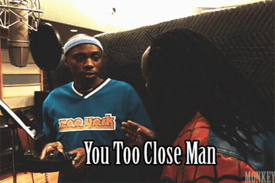Man In Zoo York Shirt Talking To Another Man GIF