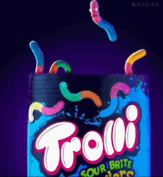 Man Inside Packet Of Worm Gummies GIF