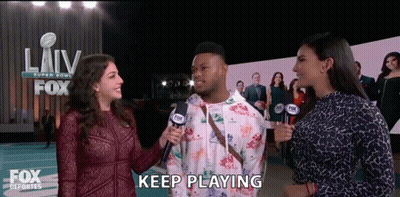 Man Interviewed By Two Women Saying Keep Playing GIF