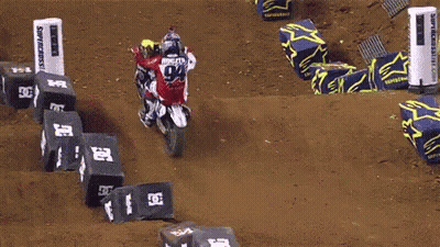 Man Jumping Dirt Bike Over Monster Energy Banner GIF
