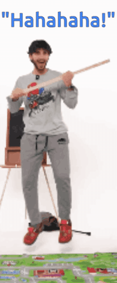 Man Jumping Holding Stick Saying Hahaha GIF