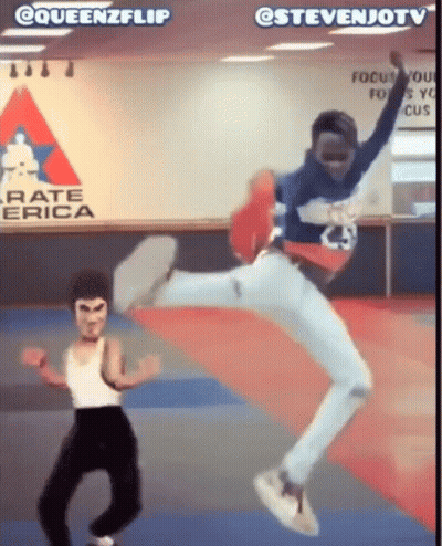 Man Jumping In Front Of Karate America Sign GIF