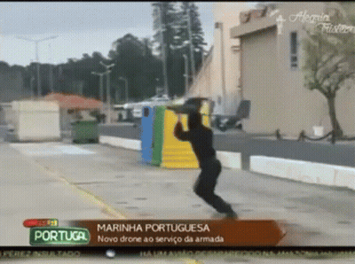 Man Jumping In Front Of Portugal Sign GIF
