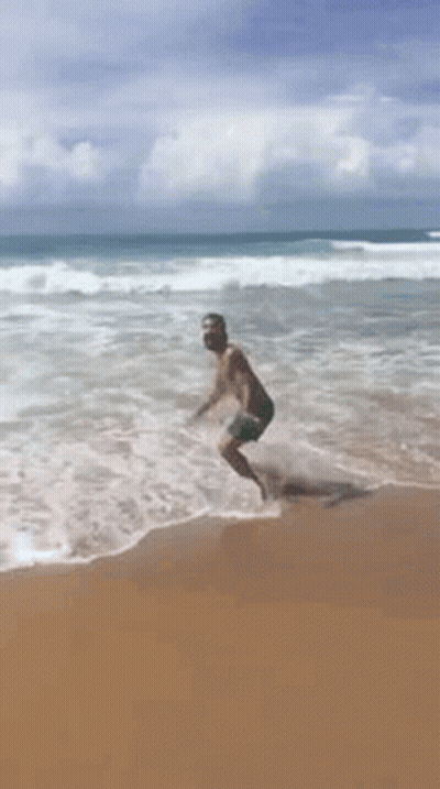 Man Jumping In Ocean GIF