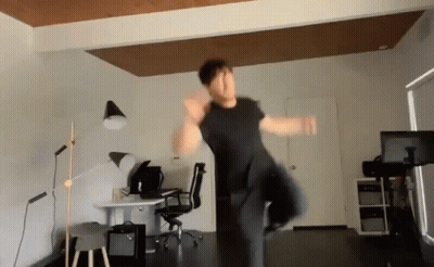 Man Jumping In Room With Desk And Chair GIF