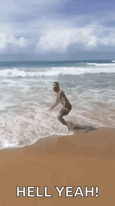Man Jumping Into Ocean Saying Hell Yeah GIF