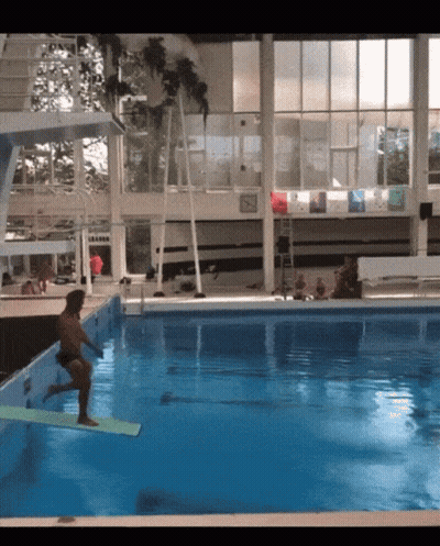 Man Jumping Into Pool With L Eau Sign GIF