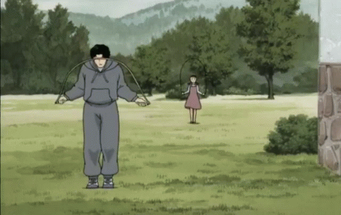 Man Jumping Jump Rope While Girl Looks On GIF