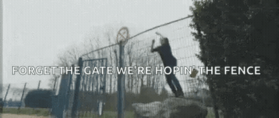 Man Jumping Over Fence Forget The Gate We're Hopin The Fence GIF