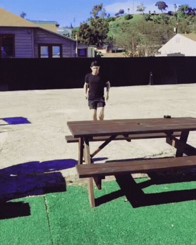 Man Jumping Over Picnic Table GIF