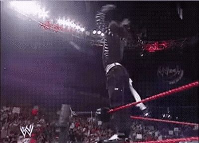 Man Jumping Over Wrestling Ring With W Logo GIF