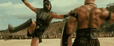 Man Kicking Another Man In Stomach GIF
