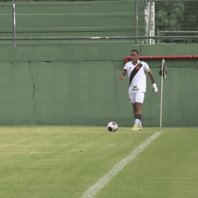 Man Kicking Soccer Ball On Green Field GIF