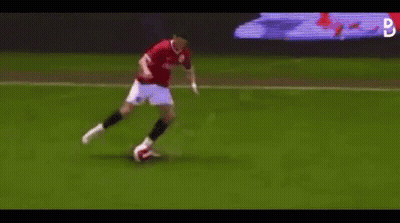 Man Kicking Soccer Ball On Soccer Field GIF