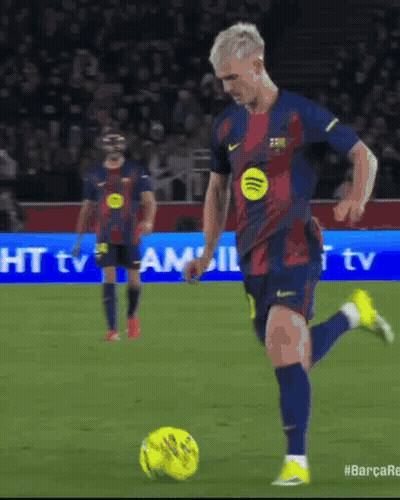 Man Kicking Soccer Ball With Spotify Logo