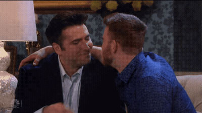 Man Kissing Another Man On Cheek NBC GIF