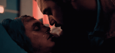Man Kissing Another Man's Forehead