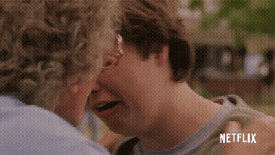 Man Kissing Another Man's Forehead With Netflix Logo GIF