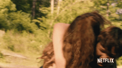 Man Kissing Another Man's Forehead With Netflix Logo GIF