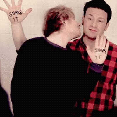 Man Kissing Another Man Saying Share It GIF