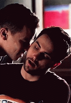 Man Kissing Another On Forehead GIF