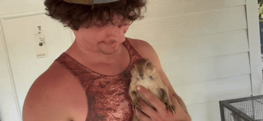 Man Kissing Prairie Dog GIF