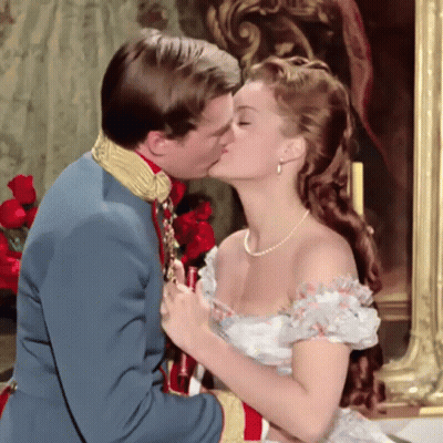 Man Kissing Woman In White Dress GIF