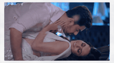 Man Kissing Woman Laying On Floor GIF
