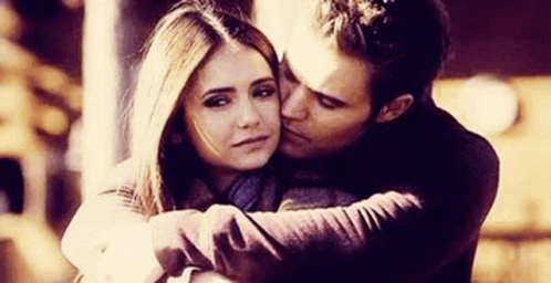 Man Kissing Woman On Cheek GIF