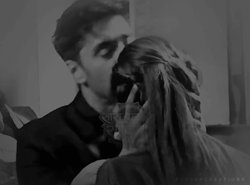 Man Kissing Woman On Cheek GIF