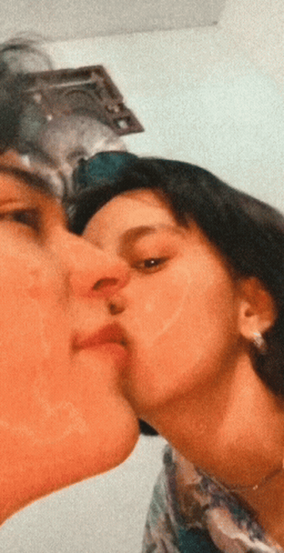 Man Kissing Woman On Cheek GIF