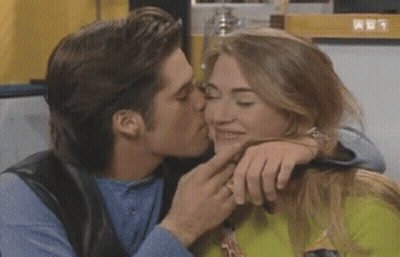 Man Kissing Woman On Cheek GIF