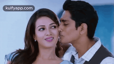 Man Kissing Woman On Cheek GIF