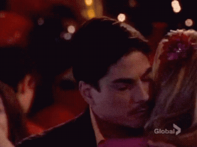 Man Kissing Woman On Cheek Saying Global GIF