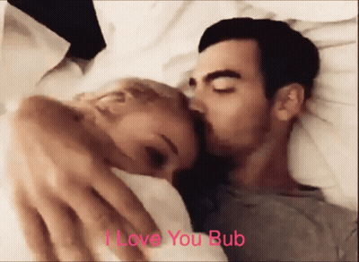 Man Kissing Woman On Cheek Saying I Love You Bub GIF