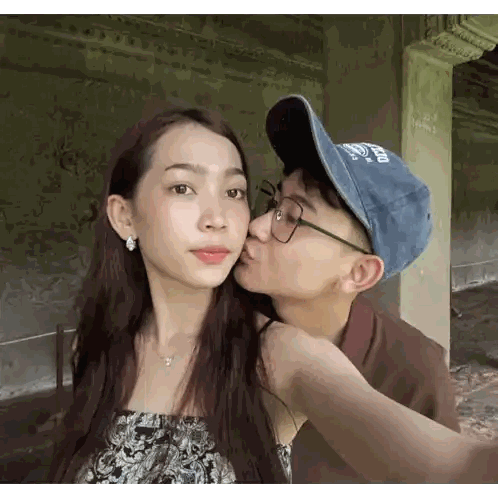 Man Kissing Woman On Cheek With Mexico Hat Sticker