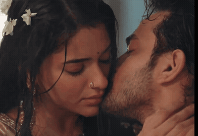 Man Kissing Woman On Cheek With Nose Ring GIF