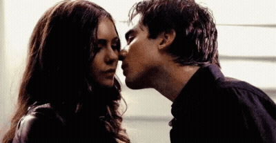 Man Kissing Woman On Cheek GIF